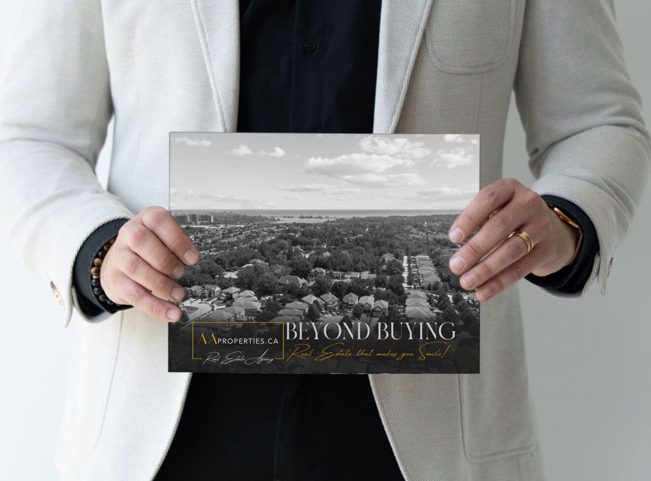The Beyond Buying booklet cover, held in two hands